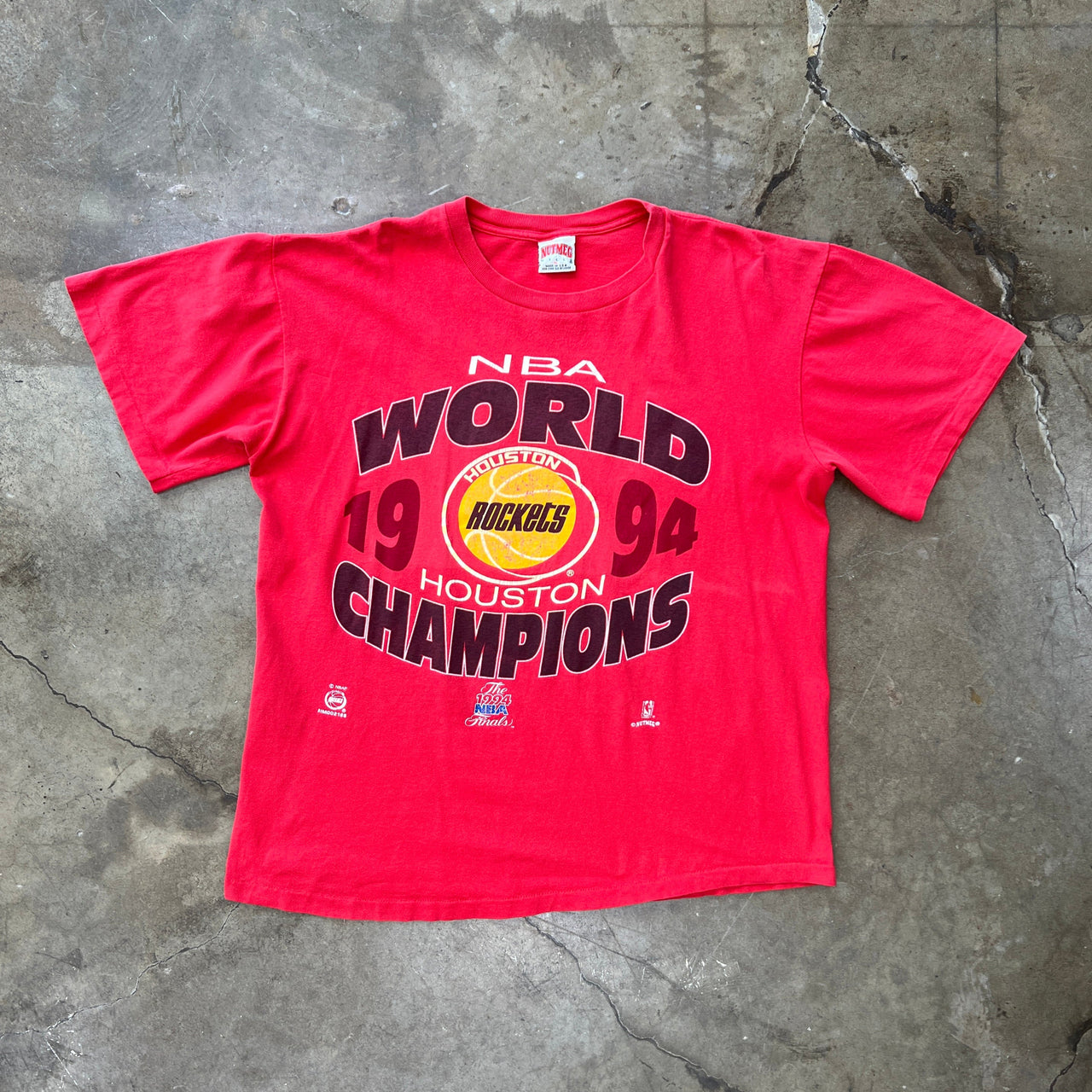 1994 NBA Rockets World Champions Nutmeg Tag Tee