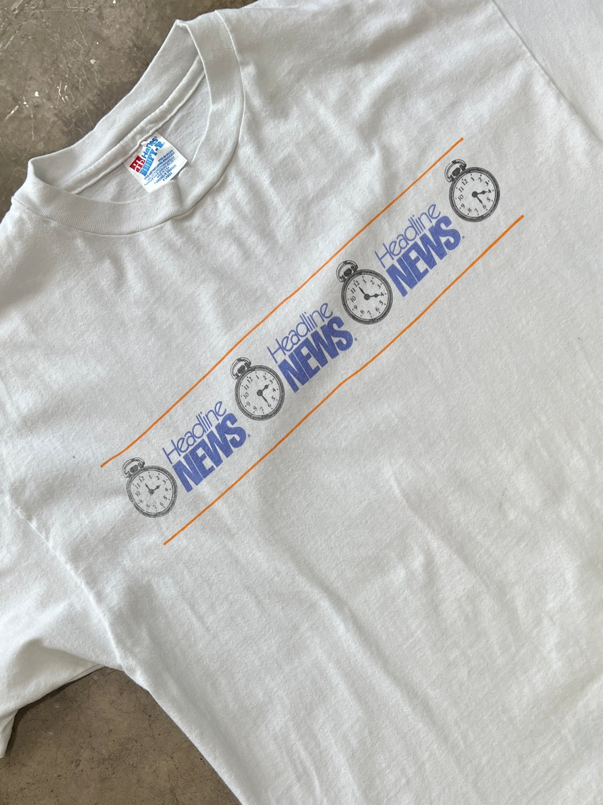 90s Headline News Stopwatch Wrap Graphic Single Stitch Tee